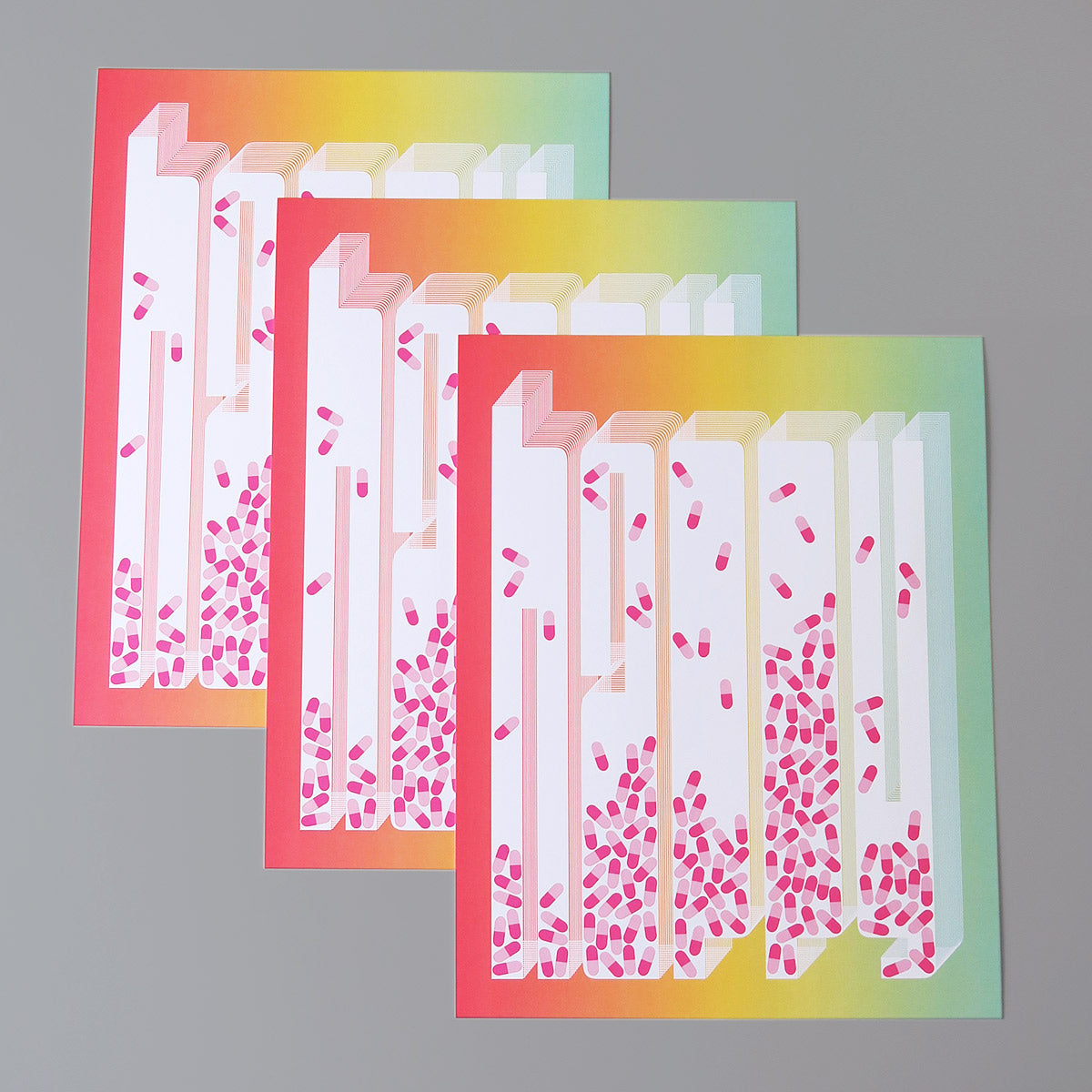 Happy Little Pill is a pop art print that is comprised of an ombre of red, yellow, and turquoise. It has pills in the centre of each letter, where the letter is knocked out white. The pills are pink and magenta.