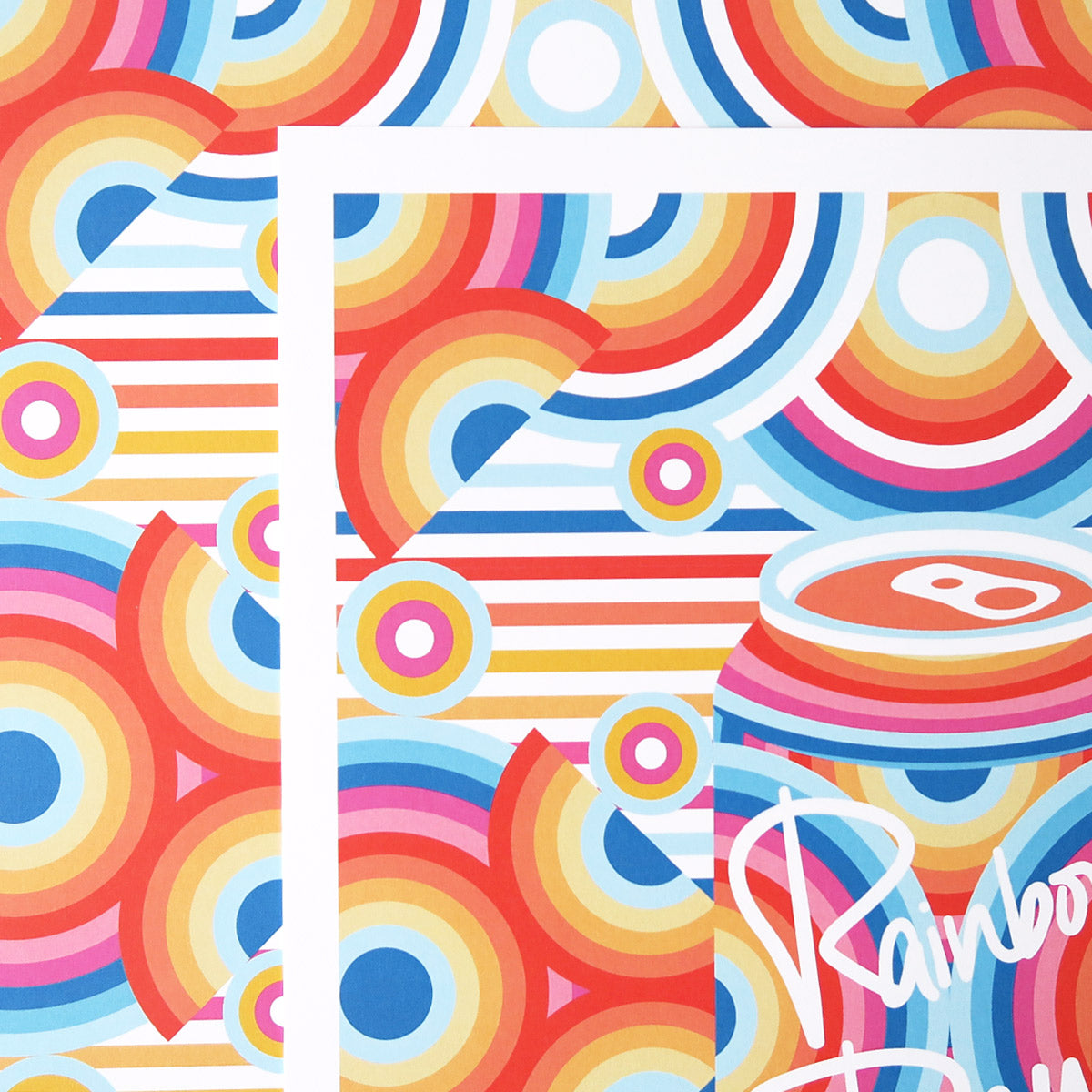 Rainbow Dew is a pop art print that has a multitude of colours. Red, blue, yellow, magenta, sun flower yellow. There are concentric circles that are arranged in a radial way with a drink can in the centre.