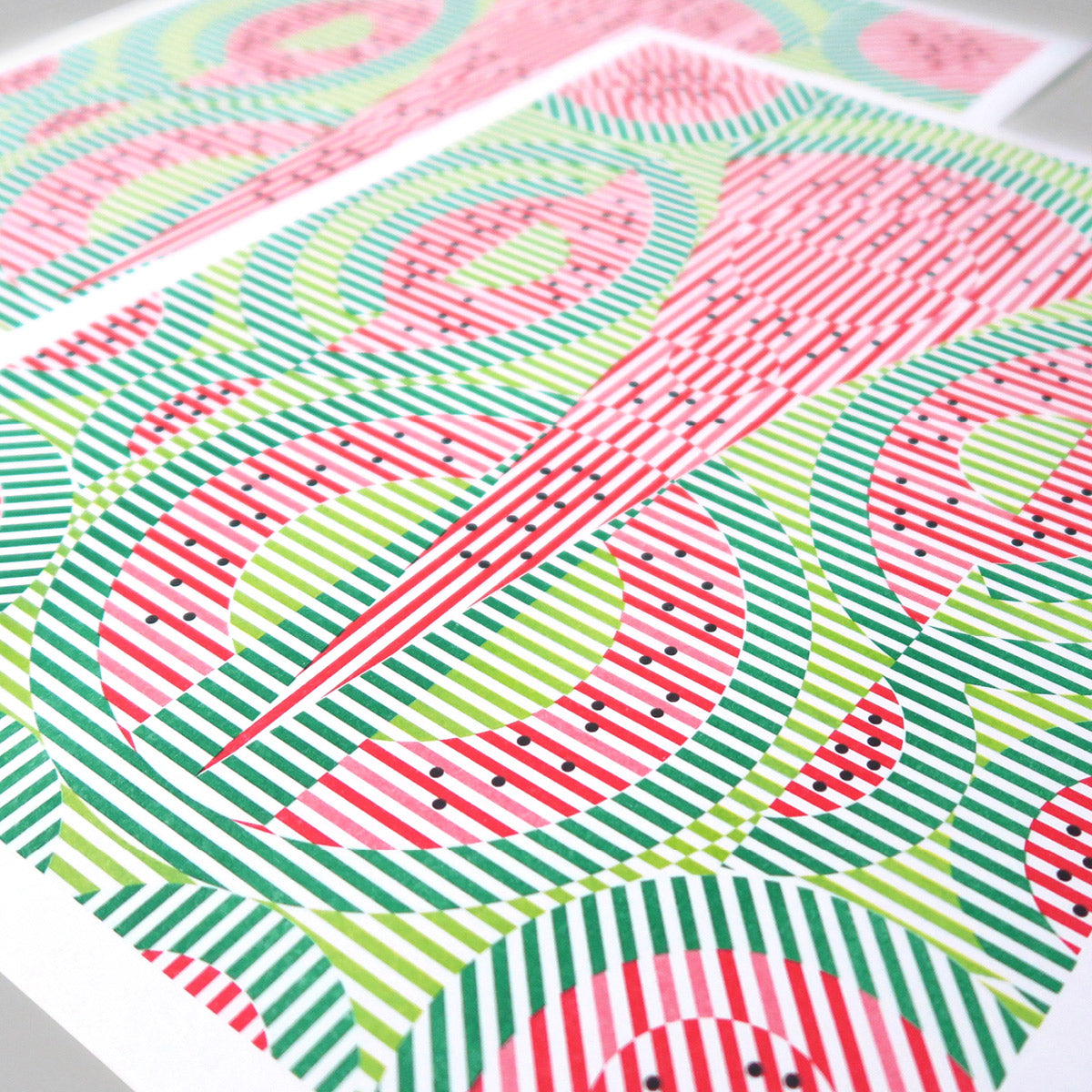 This print is called Watermelon. It has lime green, green, red, and black. The black dots are the seeds and it's an abstract representation of watermelon.