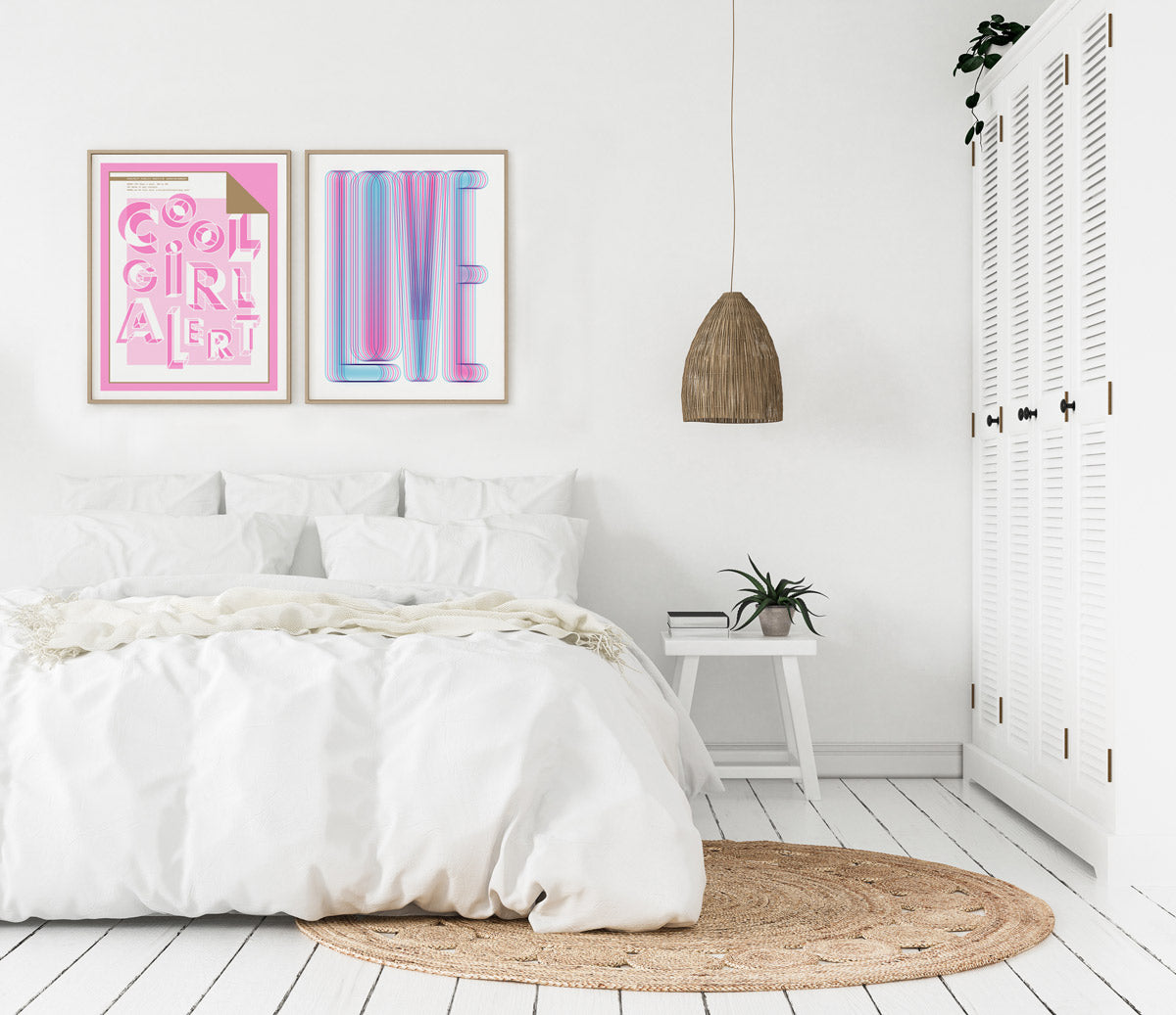 A white room with a bed and two frames one with a pink and gold poster with the words cool girl alert in the center the other frame is a blue and magenta poster with the word love