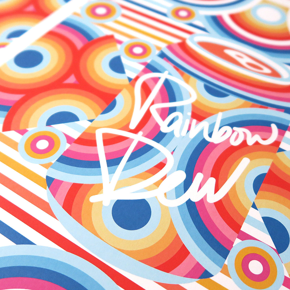 Rainbow Dew is a pop art print that has a multitude of colours. Red, blue, yellow, magenta, sun flower yellow. There are concentric circles that are arranged in a radial way with a drink can in the centre. 