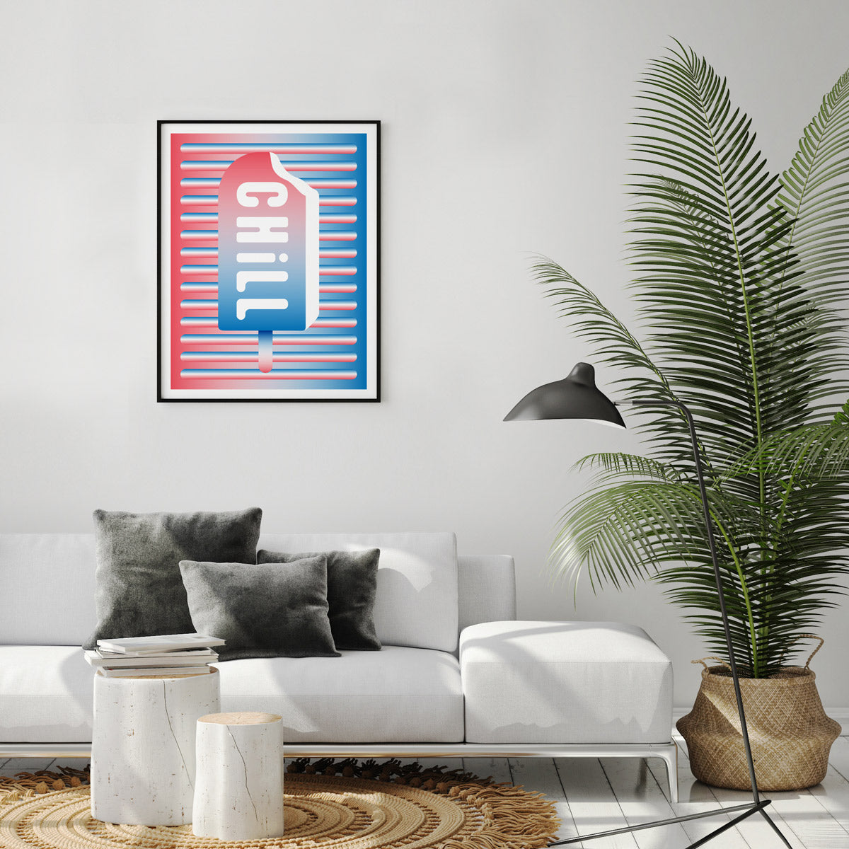 A photograph of a modern room with a graphic white red and blue popsicle poster framed in a black frame the word chill in the centre of the popsicle