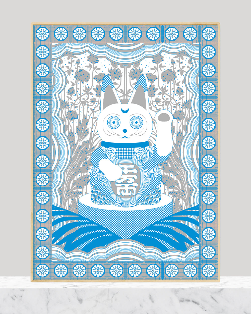 Framed print of a lucky cat figure with chinoiserie elements done in metallic silver and cobalt blue.